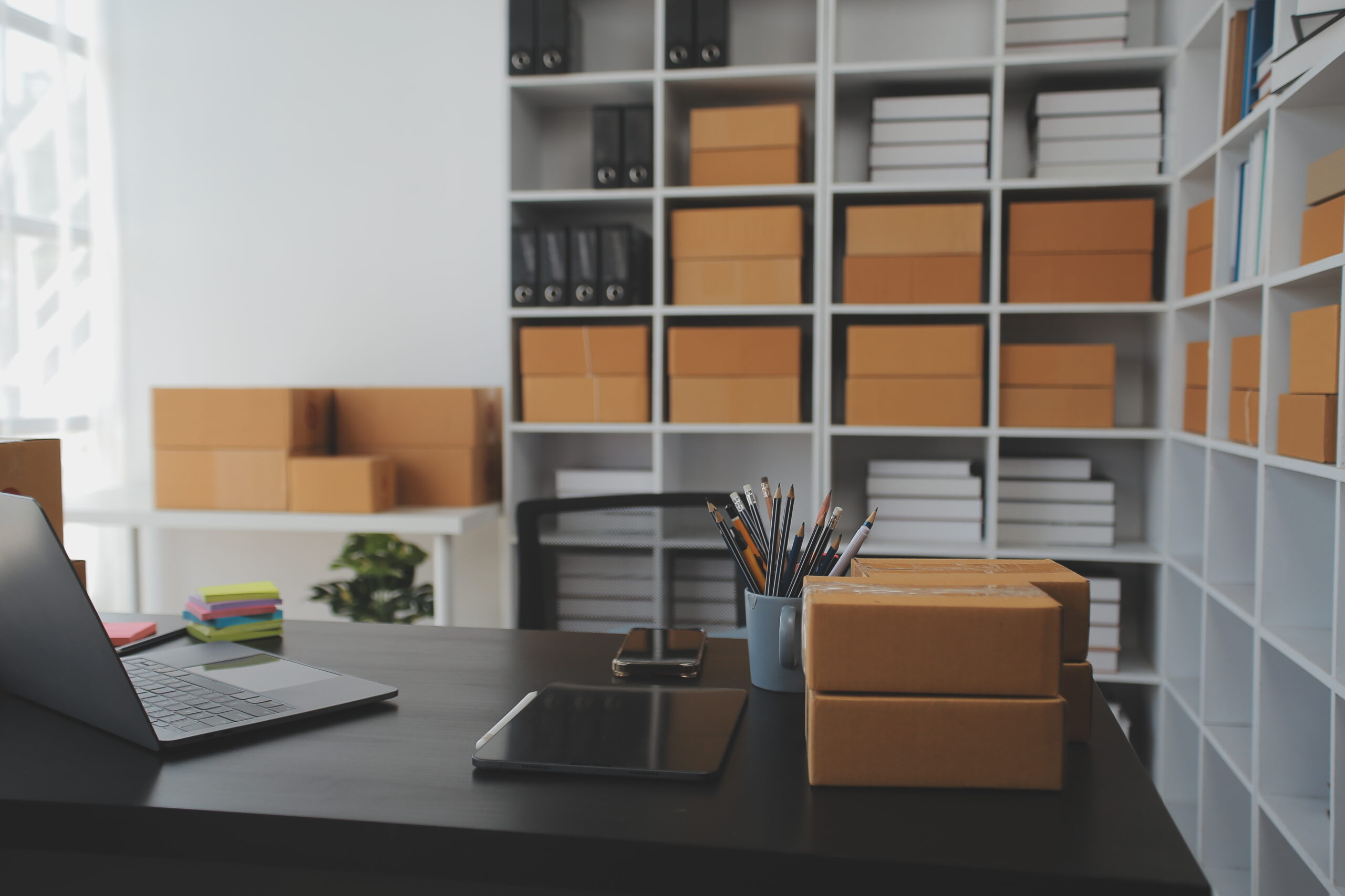 Business woman start up small business entrepreneur SME success .freelance woman working at home with Online Parcel delivery. SME and packaging deliveryconcept